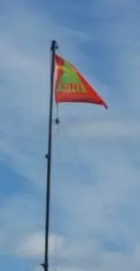 SOTA flag flying from an antenna mast.