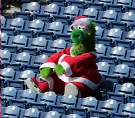 Phillie Phanatic sits alone in the stands during a game.